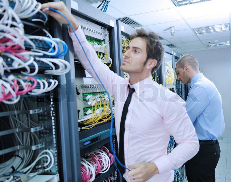 Group of young business people it engineer in network server room solving problems and give help and support, stock photo