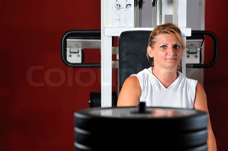 Mature healthy woman work out in fitness, stock photo