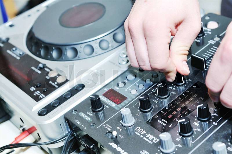 Dj equipment gramophone and mixete with dj hand on party event, stock photo