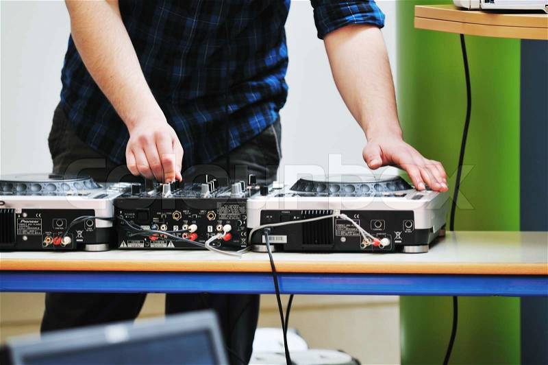 Dj equipment gramophone and mixete with dj hand on party event, stock photo