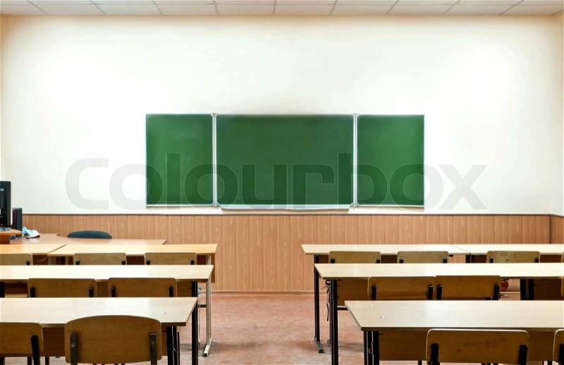 class room with a school board and school desks, stock photo