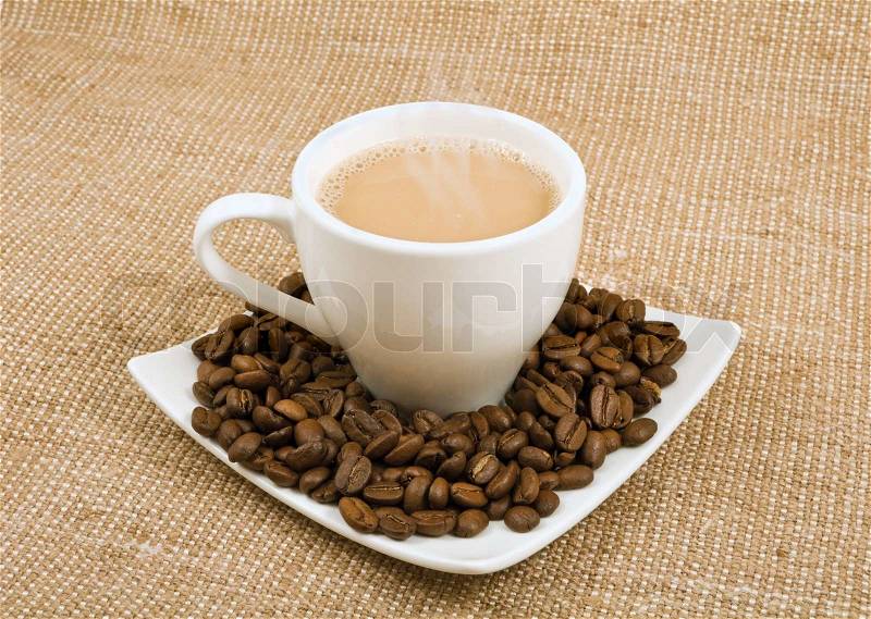 Coffee and milk and saucer with grains on a background sacking, stock photo