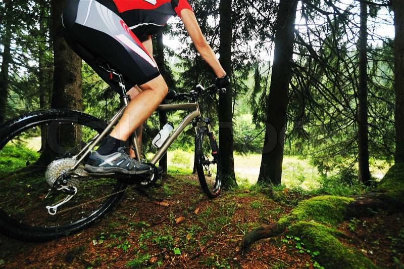 Healthy lifestyle and fitness concept with mount bike man outdoor, stock photo