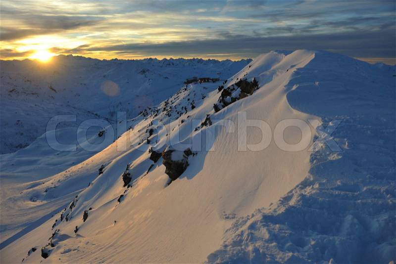 Mountain snow fresh sunset at ski resort in france val thorens , stock photo