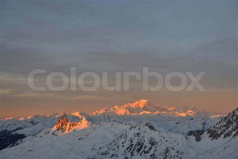 Mountain snow fresh sunset at ski resort in france val thorens , stock photo