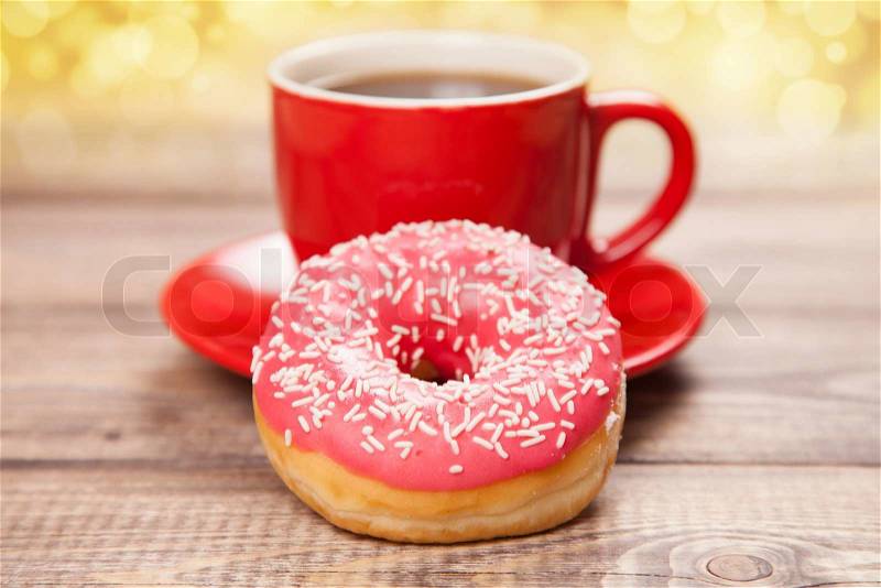 Tasty donut with a cup of coffee, stock photo