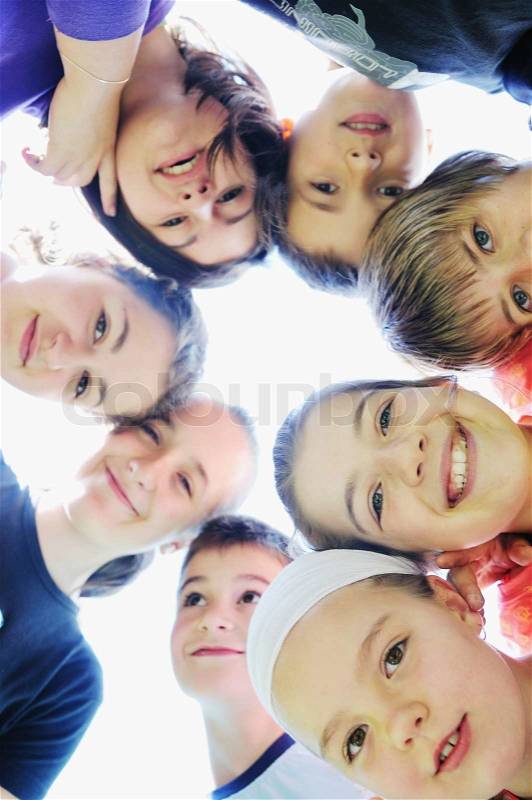 Happy child group smilling together and hold heads very close, stock photo