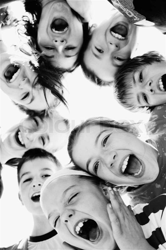 Happy child group smilling together and hold heads very close, stock photo