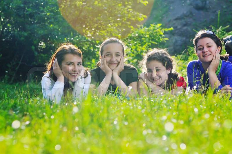 Happy children group have fun outdoor in nature at suny day, stock photo