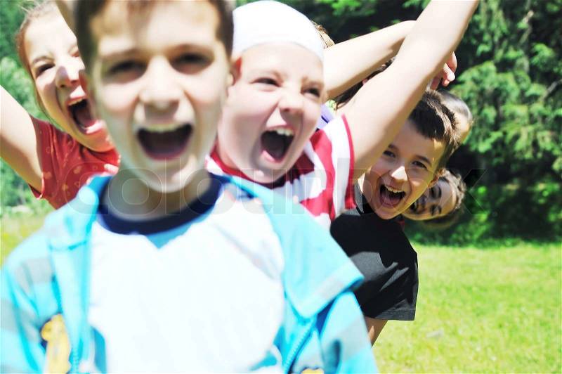 Happy children group have fun outdoor in nature at suny day, stock photo