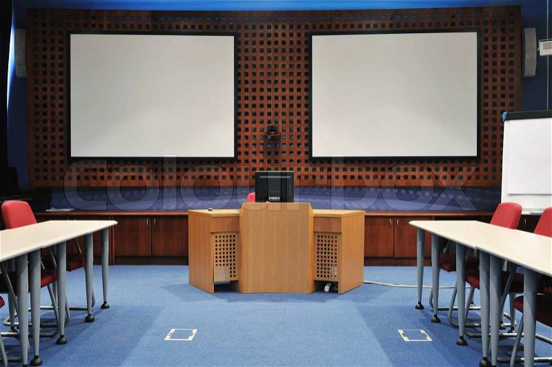 Video conference room with chairs and big board projector canvas and computer, stock photo
