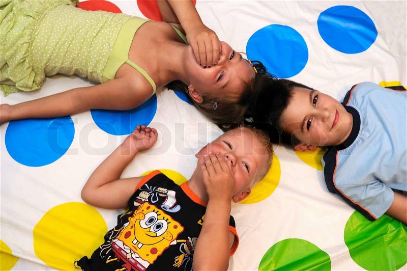 Happy three kids playing together and smiling, stock photo