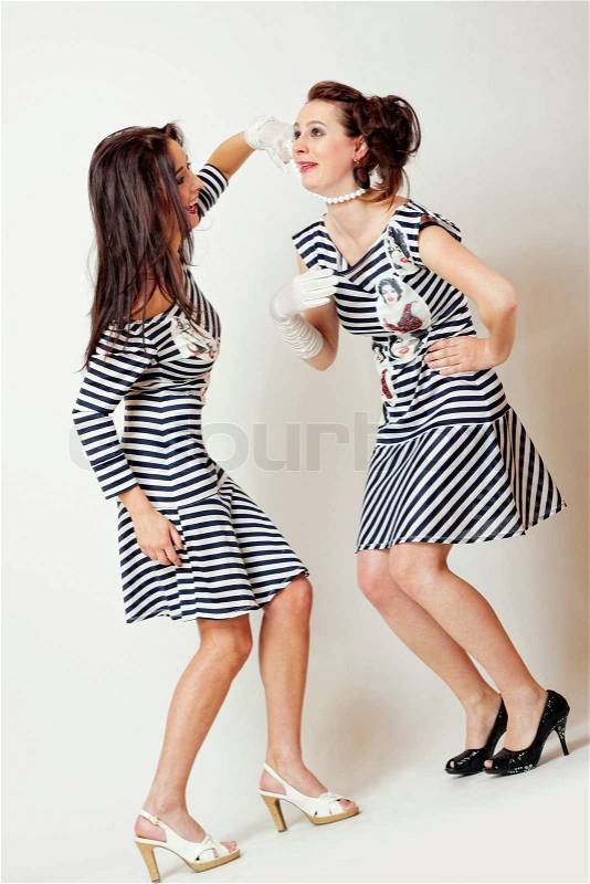 Two fashion emotion girl in strip clothes, stock photo