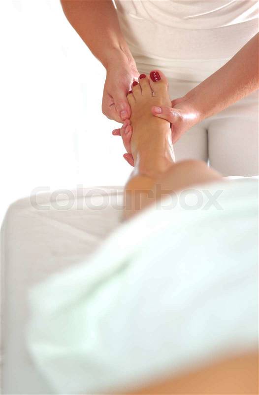Leg and foot massage at the spa and wellness center, stock photo