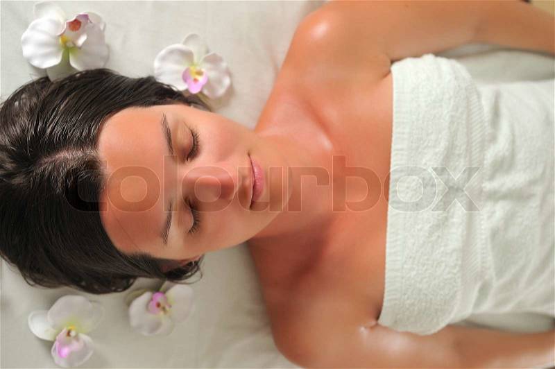 Happy young woman in spa, stock photo