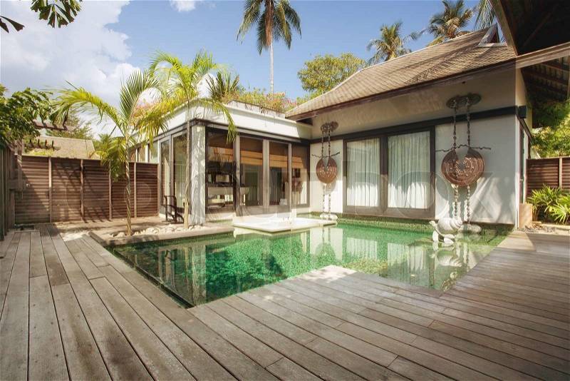 Panoramic view of nice tropical villa with pool, stock photo