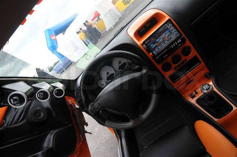 Racing sport car with orange details interior, stock photo