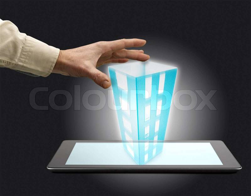 Build a tower with a tablet pc with Male hands hold, stock photo