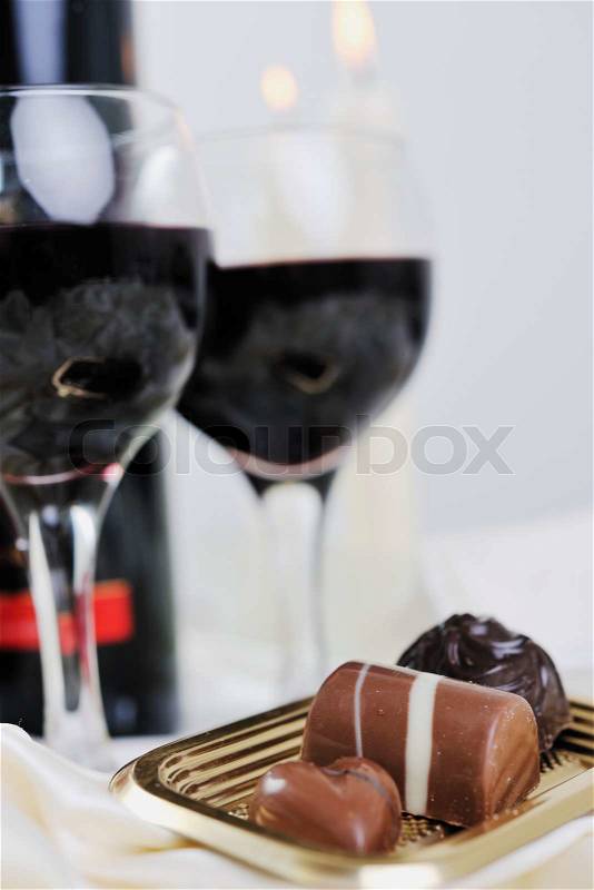 Luxury and sweet praline and chocolate with wine bottle and glasses decoration, stock photo
