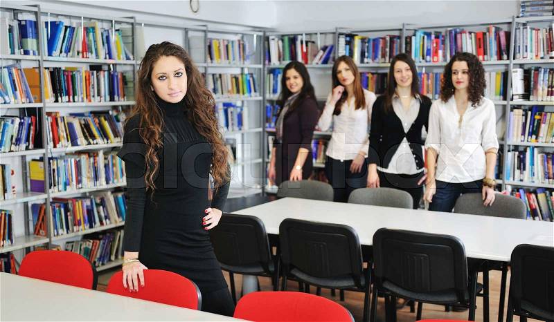 Happy student woman group portrait at library , stock photo