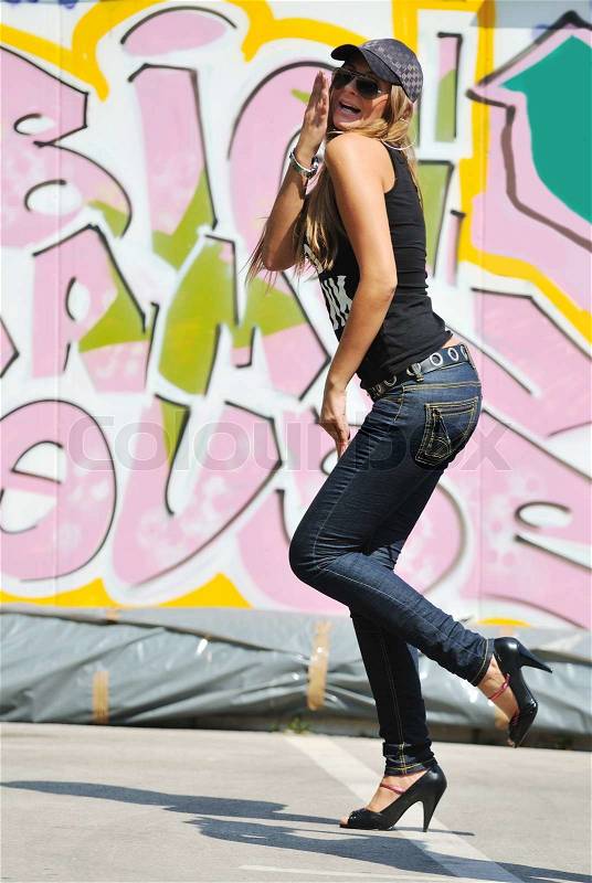 Young pretty urban modern fashion woman pose outdoor on street, stock photo