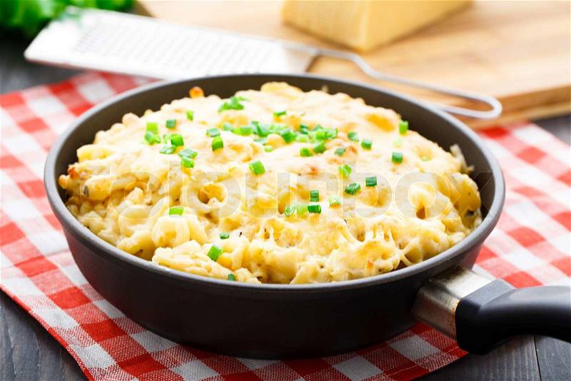 Delicious baked macaroni and cheese with scallion, stock photo