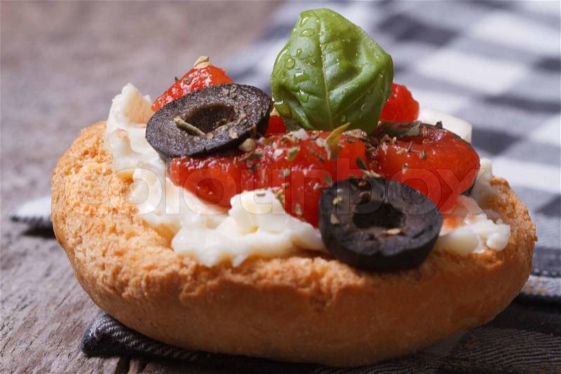 Fragrant Bruschetta with tomatoes, cheese and olives on the table. , stock photo