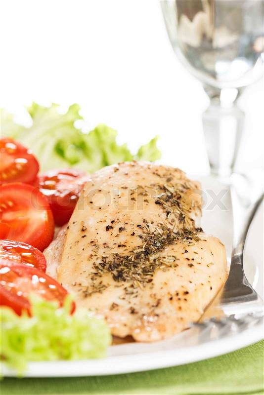 Chicken meet with tomatoes in plate, stock photo