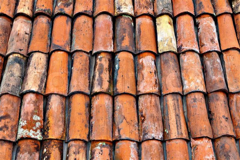 Closeup of weathered old dirty Italian clay tiles, stock photo