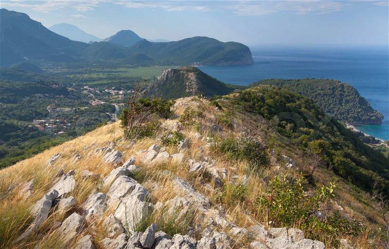 Coastal mountain landscape with dry grass on rock, Montenegro, stock photo
