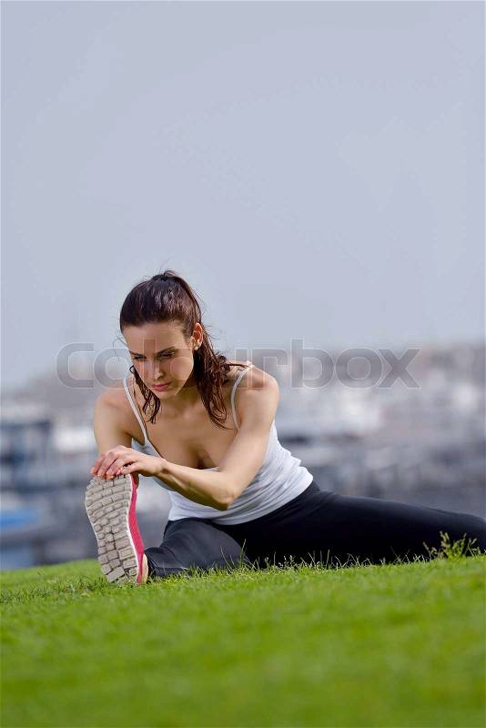 Young beautiful woman jogging and running on morning at park in the city. Woman in sport outdoors health and fitness concept, stock photo