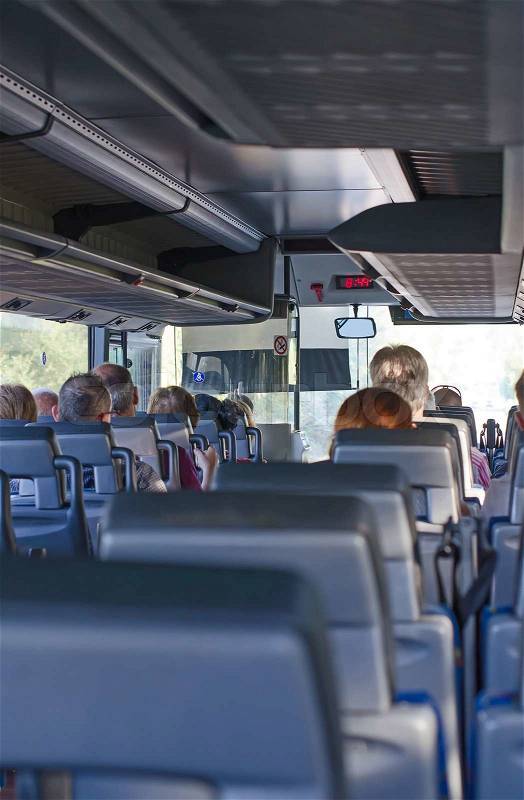 View from inside the bus with passengers, stock photo