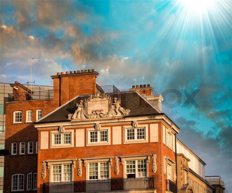Sunset sky in London above old city buildings, stock photo
