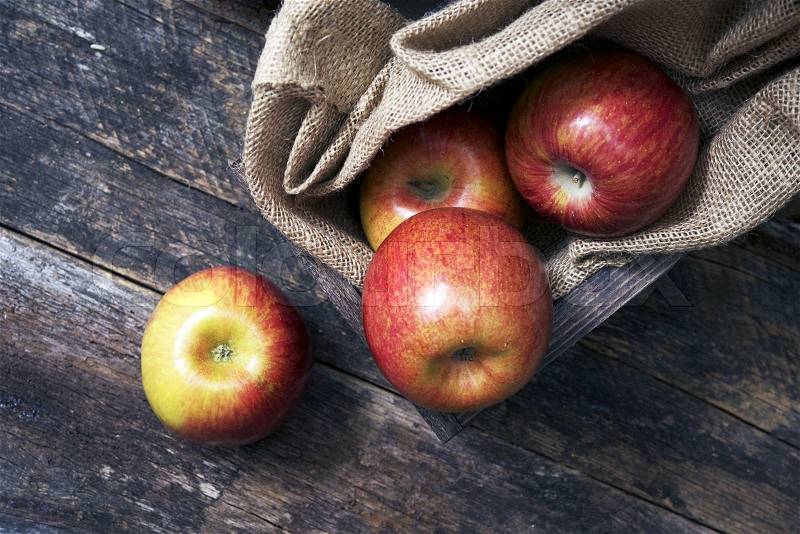 Organic Apples on Wood. Fresh Apples in Wooden Crate with Canvas, stock photo