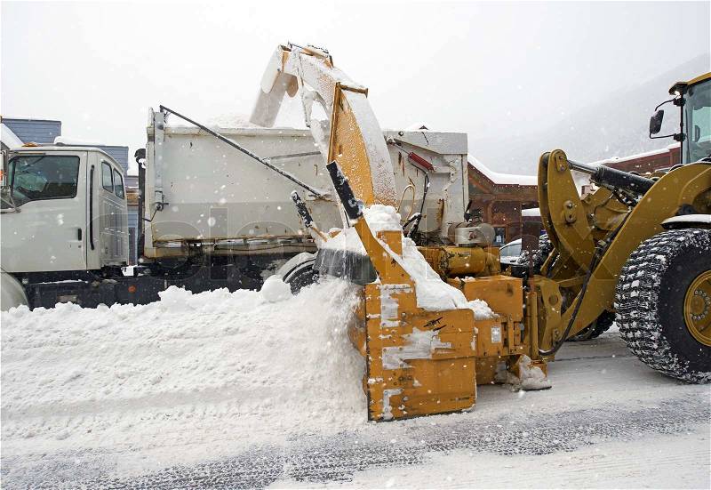 Street Snow Removal by Heavy Equipment. Colorado Snow Removal, stock photo
