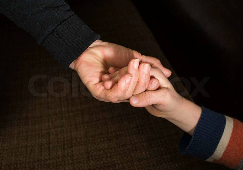 Two hands caught. Adult and child hand, stock photo