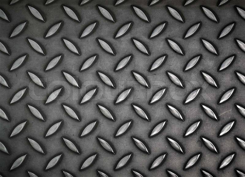 Dark gray steel sheet with diamond pattern relief, stock photo