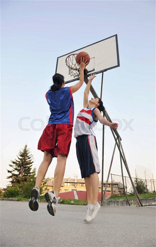Woman basketball player have treining and exercise at basketball court at city on street, stock photo