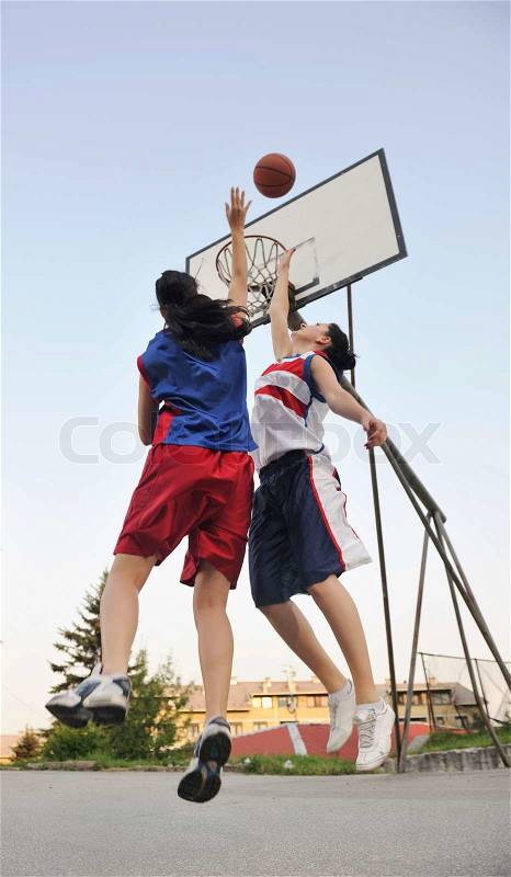 Woman basketball player have treining and exercise at basketball court at city on street, stock photo