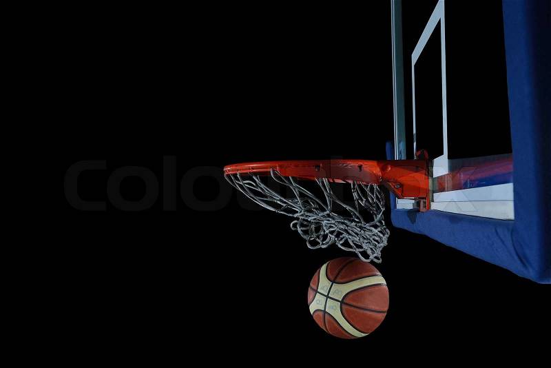 Basketball ball, board and net on black background in gym indoor, stock photo