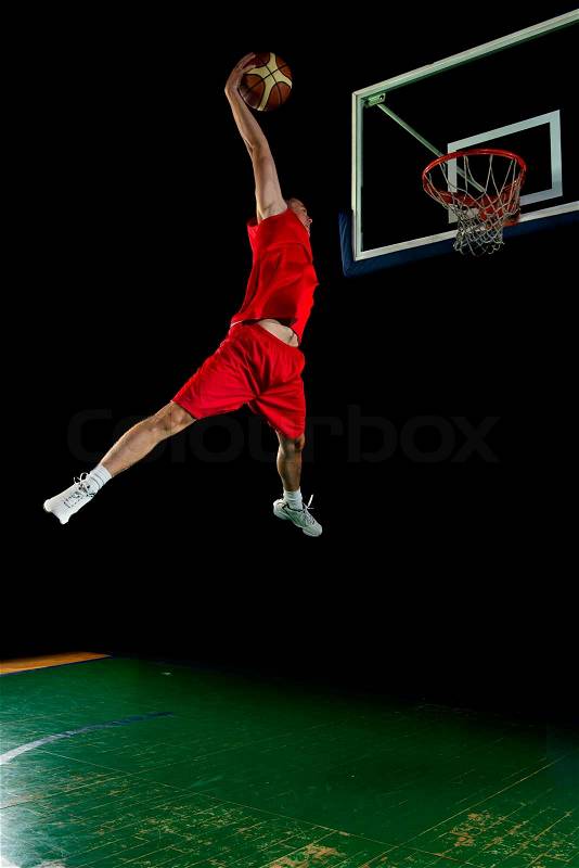Basketball game sport player in action isolated on black background, stock photo