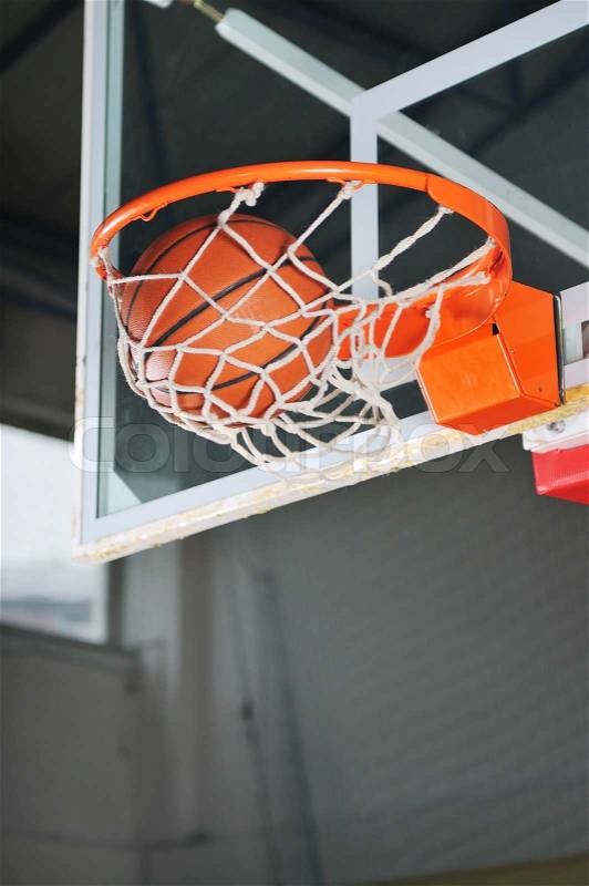 Oreange basket ball in basketball basket, stock photo