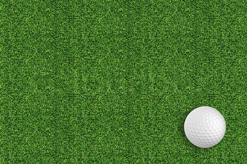 Golf ball on the green grass of the golf course, stock photo
