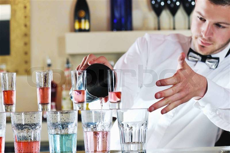 Pro barman prepare coctail drink and representing nightlife and party event concept, stock photo