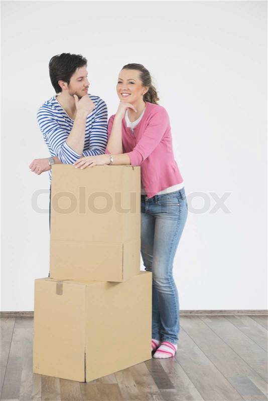 Happy Young couple moving in new home, stock photo