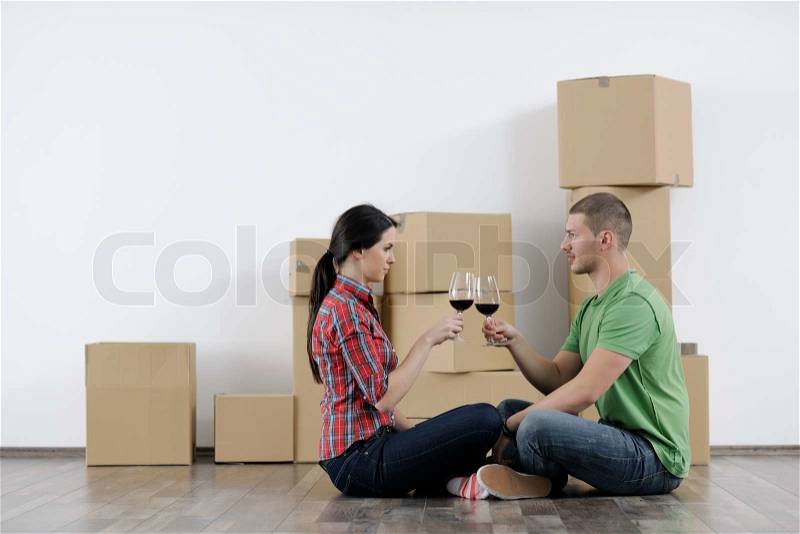 Happy Young couple moving in new home, stock photo