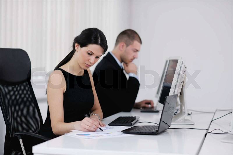 Business people group with headphones giving support in help desk office to customers, manager giving training and education instructions, stock photo