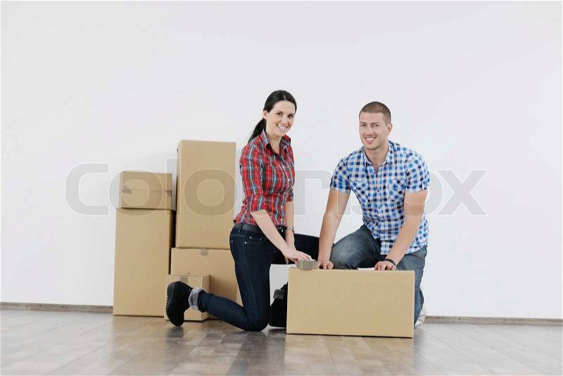 Happy Young couple moving in new house, stock photo