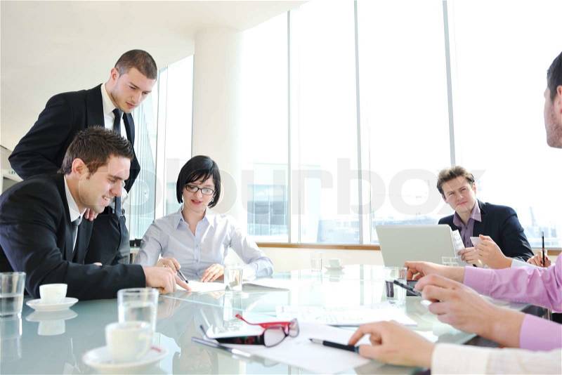 young business people group have meeting at conference room and have discusion about new ideas plans and problems, stock photo