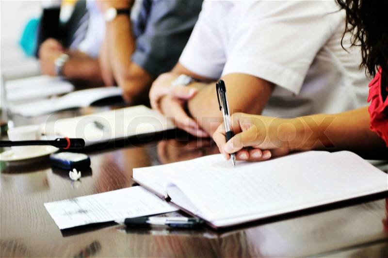 Business beople on meeting conference taking notes and make deal , stock photo
